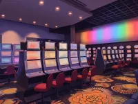 Slot row with red stools at Cascades Langley
